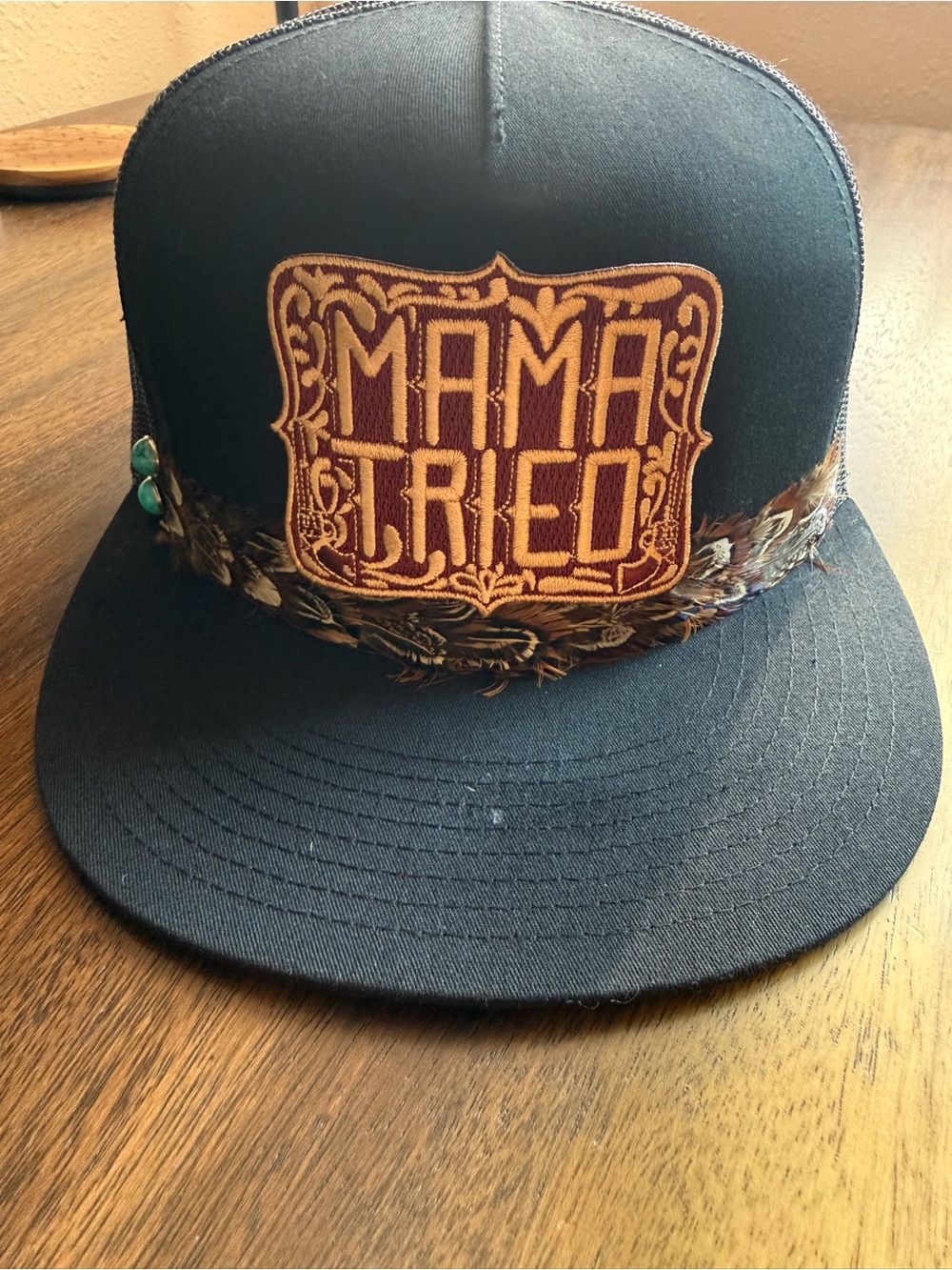 The Classic Black Snapback Cap with Brown Embroidered Patch